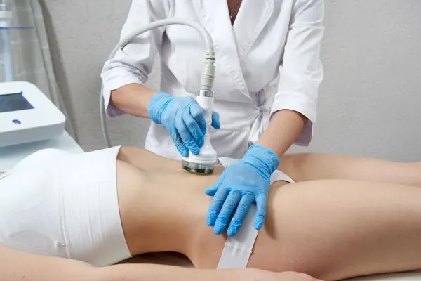 Lost the Weight but Not the Loose Skin? 2 woman having HIFU treatment on her stomach to combat loose skin Sunderland following weight loss